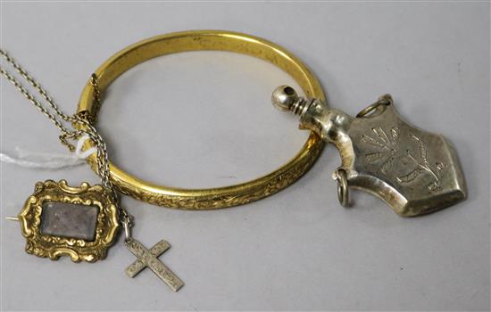 A Victorian mourning brooch, a bangle, scent flask and cross pendant.